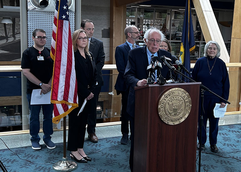 Photo: Senator Bernie Sanders held a press conference on May 19 at the Leahy Burlington International Airport to discuss the healthcare crisis. Speakers included State Sen. Virginia "Ginny" Lyons (far right), State Rep. Alyssa Black (left), and to her left Owen Foster, Chair of the Green Mountain Care Board. VermontBiz photo.